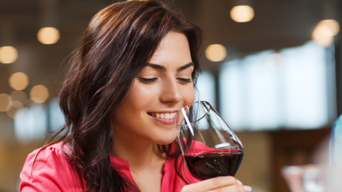 woman drinking a glass of wine