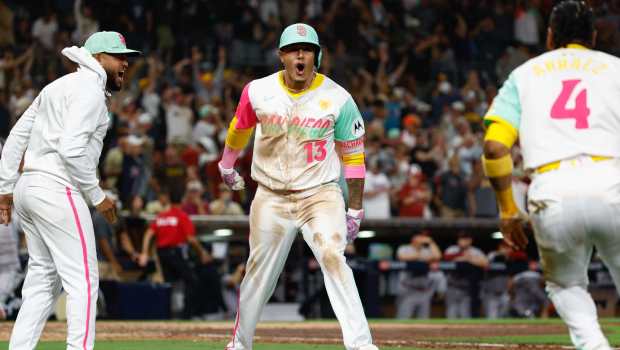 Manny Machado (13) celebrates his home run late in the game.  (Meg McLaughlin / The San Diego Union-Tribune)