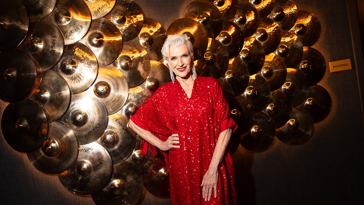 Maye Musk wearing a sparkling red dress.