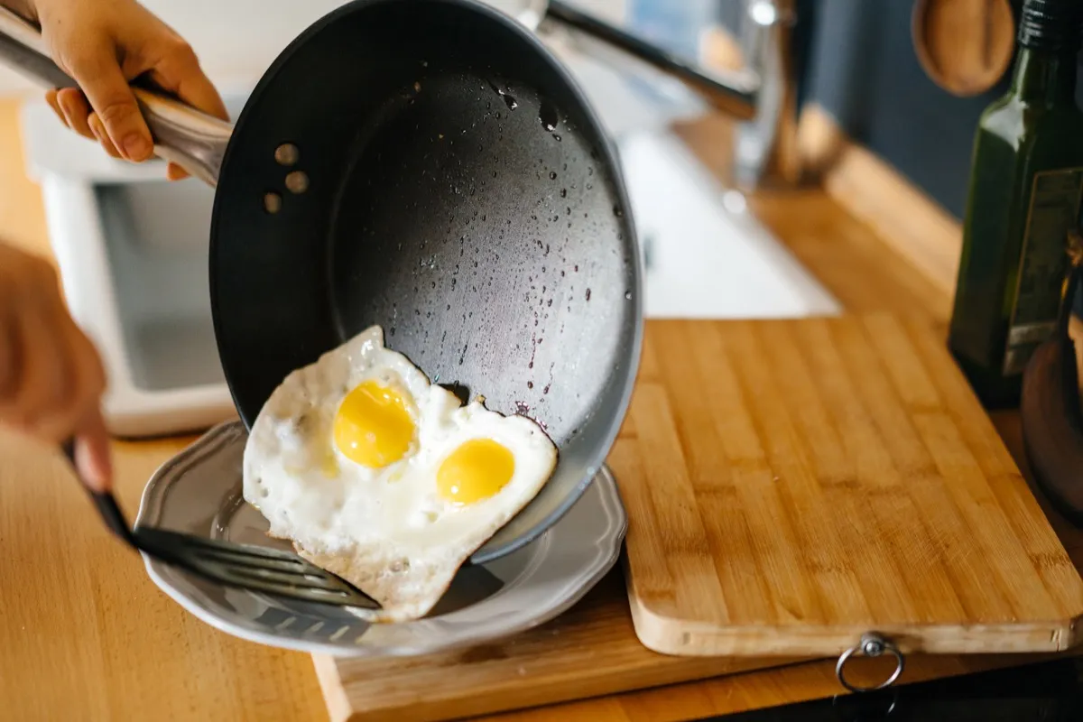 cook eggs in a pan