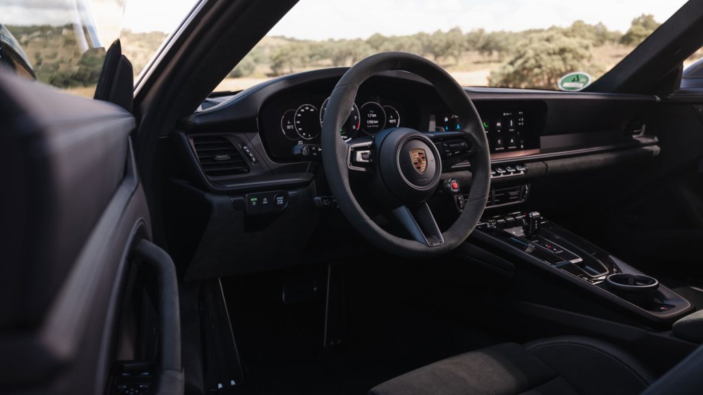 The interior of a Porsche 911 Carrera GTS hybrid.