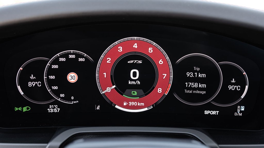 Close-up of the digital dashboard of a Porsche 911 Carrera GTS hybrid.