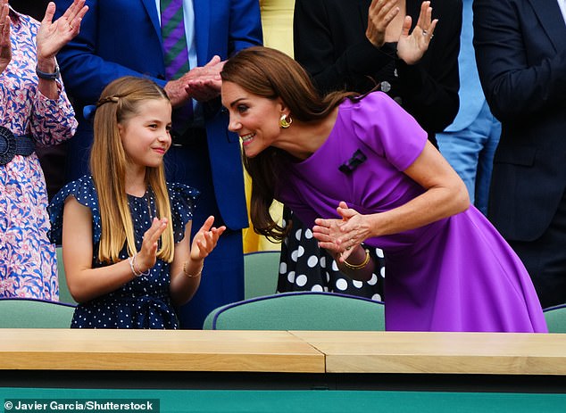 Charlotte and Kate smile as they watch the action begin on Centre Court from the Royal Box