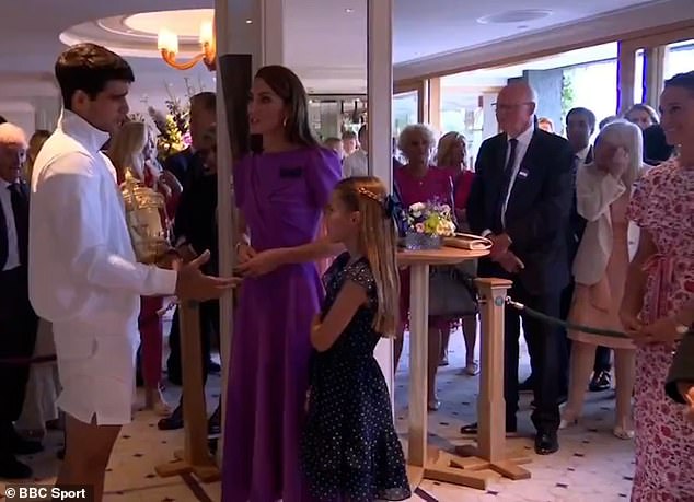 A star-struck Charlotte looked slightly shy as she stood next to Kate and smiled at Alcaraz during their conversation, while her aunt Pippa stood behind the pair and smiled at the interaction.