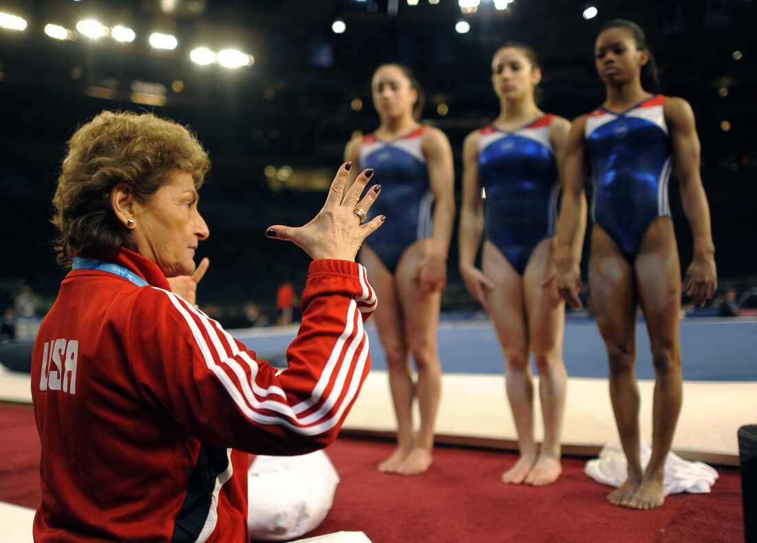 Then-U.S. national team coach Marta Karolyi chats with, from left, Jordyn Wieber, Alexnadra Raisman and Gabby Douglas during practice for the 2012 AT&T American Cup at Madison Square Garden in New York City in March 2012.