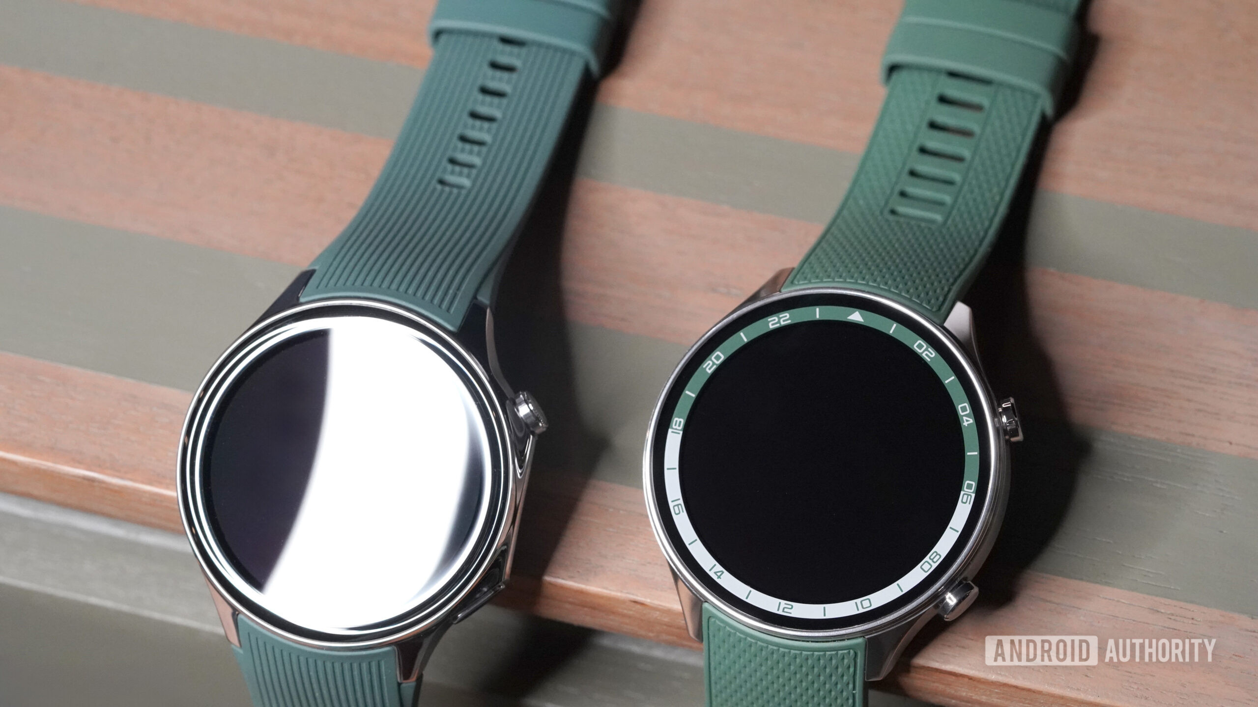 A OnePlus Watch 2 sits next to a OnePlus Watch 2R.