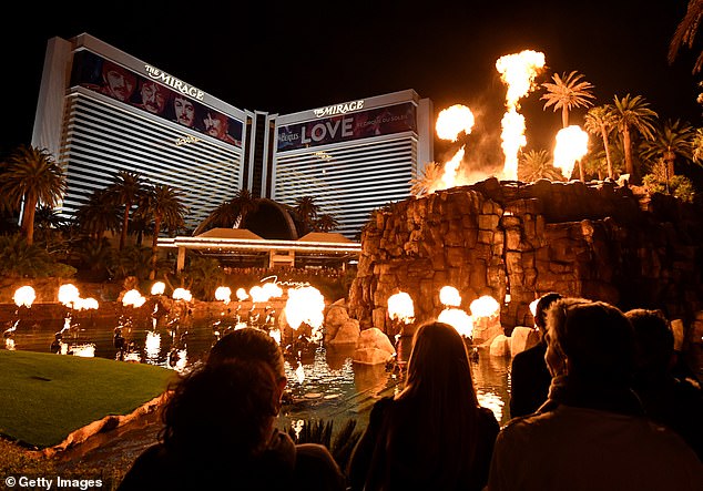 Visitors to the Mirage observe the complex's volcanic attraction