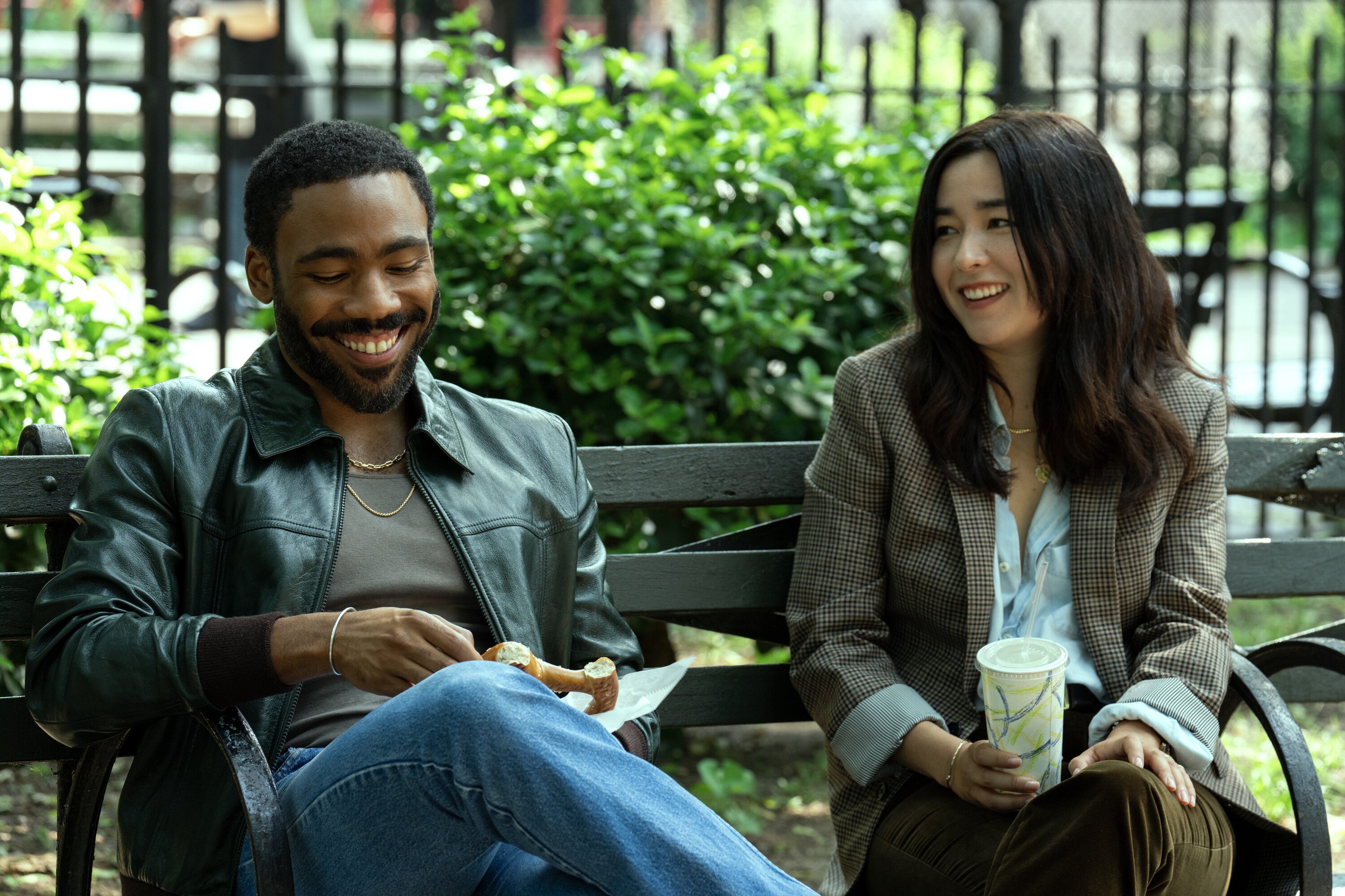 Donald Glover as John and Maya Erskine as Jane in 