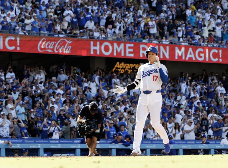 Shohei Ohtani cheers as he reaches home plate after his fifth-inning home run.