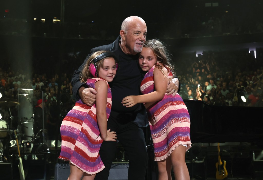 NEW YORK, NEW YORK - JULY 25: Della Rose Joel, Billy Joel and Remy Joel perform onstage during the final show of Billy Joel's residency at Madison Square Garden on July 25, 2024 in New York City. (Photo by Kevin Mazur/Getty Images)