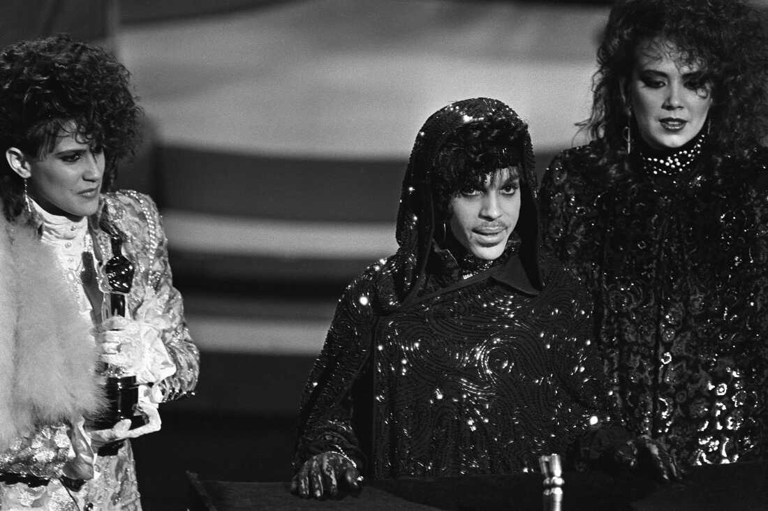 Prince, alongside Wendy Melvoin (left) and Lisa Coleman (right) accepts the Oscar for Best Original Score for Purple Rain in 1985. 