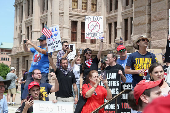 AUSTIN, TEXAS - APRIL 25: Protesters gather outside the Texas State Capitol during a rally calling for the reopening of Austin and Texas on April 25, 2020 in Austin, Texas. Governor Greg Abbott said he is consulting with health professionals to create a plan to safely reopen the state of Texas and is expected to make an announcement in the coming days. (Photo by Gary Miller/Getty Images)