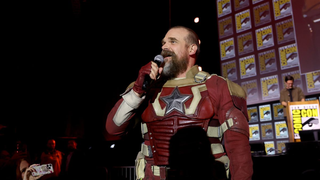 David Harbour dressed as Red Guardian character with microphone