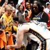 Indiana Fever rookie Caitlin Clark signs autographs after a game Friday against the Washington Mystics that was attended by more than 20,000 fans, the largest attendance for a WNBA game in 17 years.