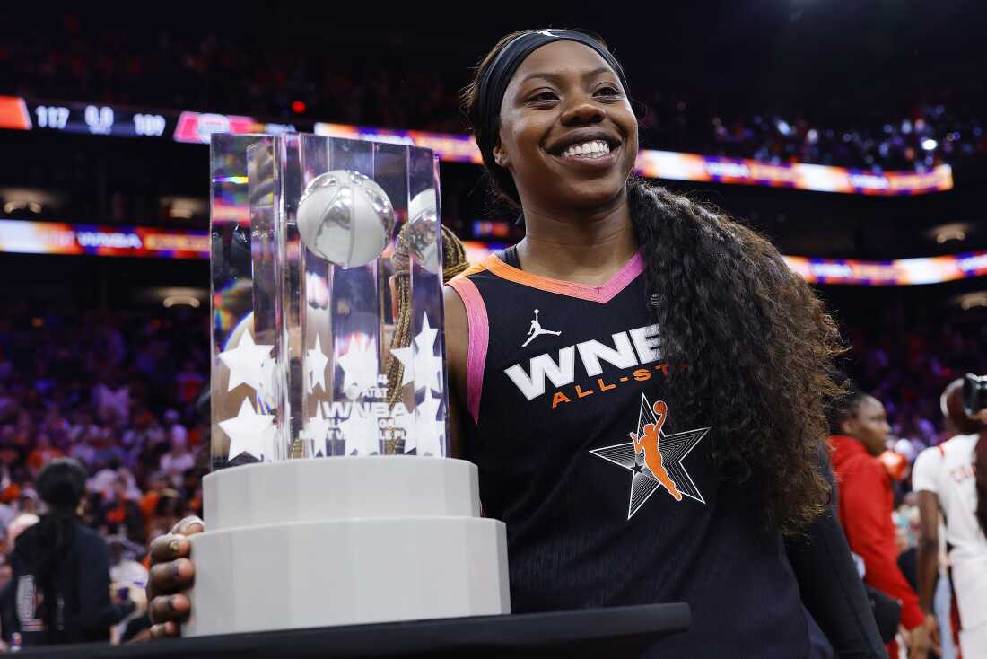 Arike Ogunbowale, who left the U.S. Women's Olympic Team, celebrates with the MVP trophy after the WNBA team defeated the Olympic team 117-109 during the 2024 WNBA All-Star Game in Phoenix, Arizona, on July 20, 2024.