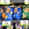 Bags of Lay's potato chips are for sale on the shelves of a store.