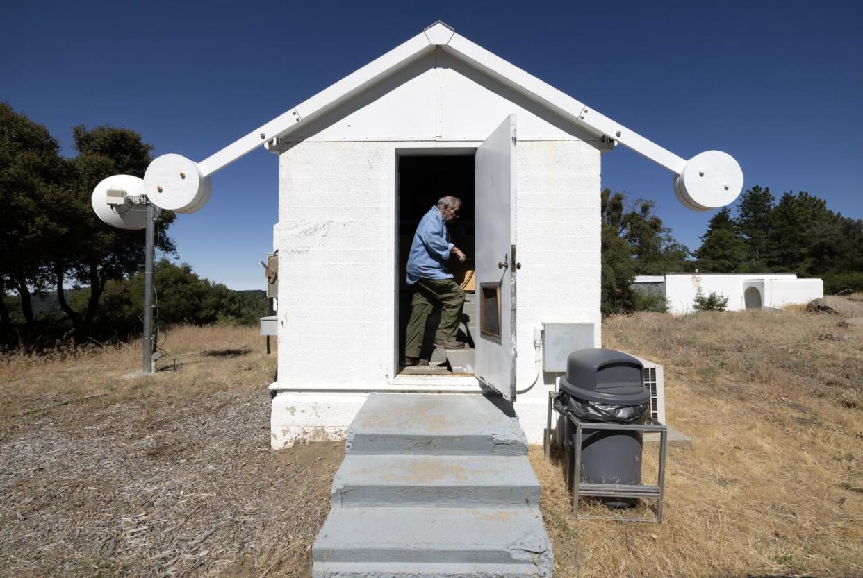 Steve Flanders enters the small building on the grounds of Palomar Observatory where the Gattini-IR telescope is installed.