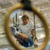 Hobie Biliouris, 14, of the Arlington Tigers gymnastics team, practices on the rings at Barcroft Sports & Fitness Center in Arlington, Virginia, on July 2. He recently joined the Tigers after his previous team ended its boys program.