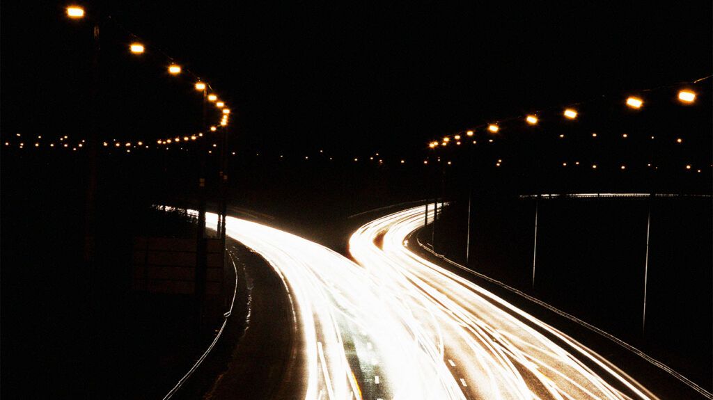 highway intersection lit up at night