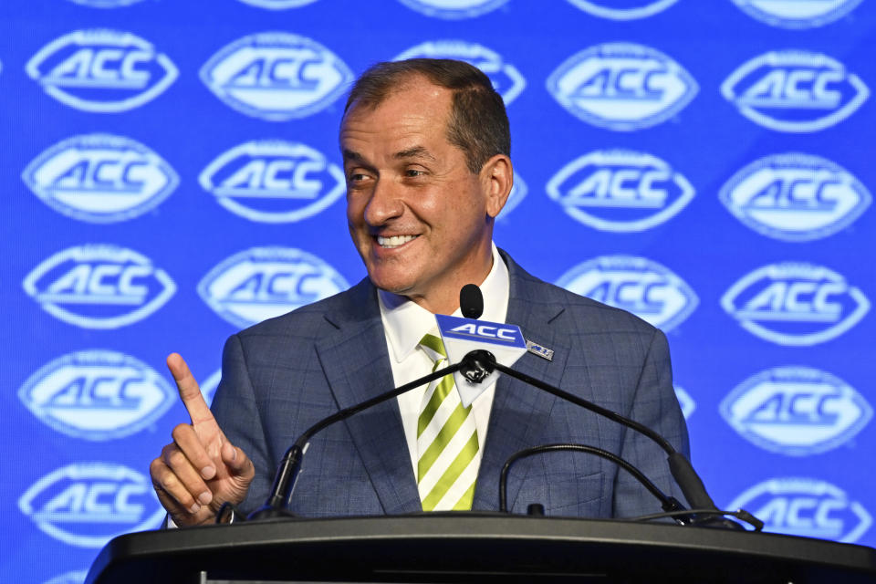 ACC Commissioner Jim Phillips smiles during a college football news conference Monday. (AP Photo/Matt Kelley)