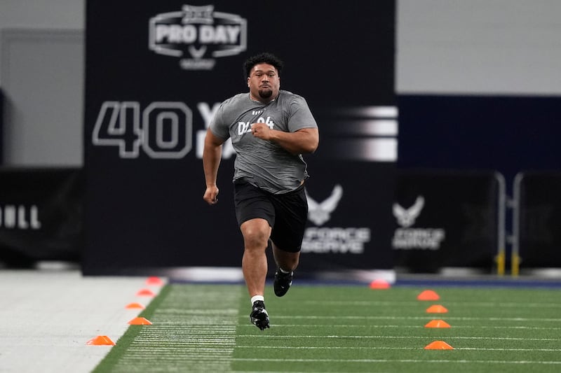 BYU defensive lineman Atunaisa Mahe sprints during NCAA Big 12 college football pro day, Saturday, March 30, 2024, in Frisco, Texas. (AP Photo/LM Otero)