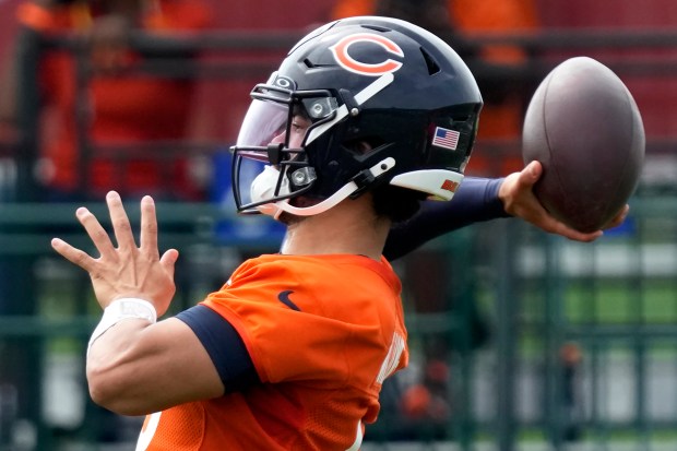 Chicago Bears quarterback Caleb Williams throws during football practice in Lake Forest, Ill., Tuesday, July 23, 2024. (AP Photo/Nam Y. Huh)