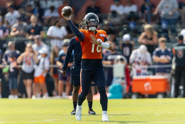 Chicago Bears quarterback Caleb Williams (18) throws the ball during a practice with full protection at Chicago Bears training camp on July 26, 2024, in Lake Forest. (Stacey Wescott/Chicago Tribune)