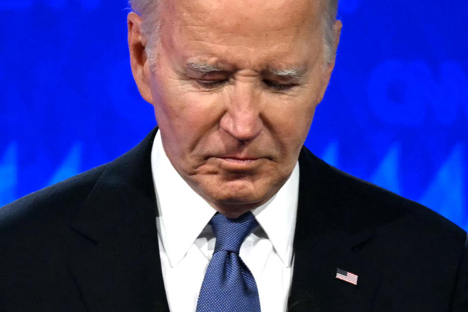 TOPSHOT - U.S. President Joe Biden looks down as he participates in the first presidential debate of the 2024 election with former U.S. President and Republican presidential nominee Donald Trump at the CNN studios in Atlanta, Georgia, on June 27, 2024. (Photo by Andrew CABALLERO-REYNOLDS / AFP) (Photo by ANDREW CABALLERO-REYNOLDS/AFP via Getty Images)