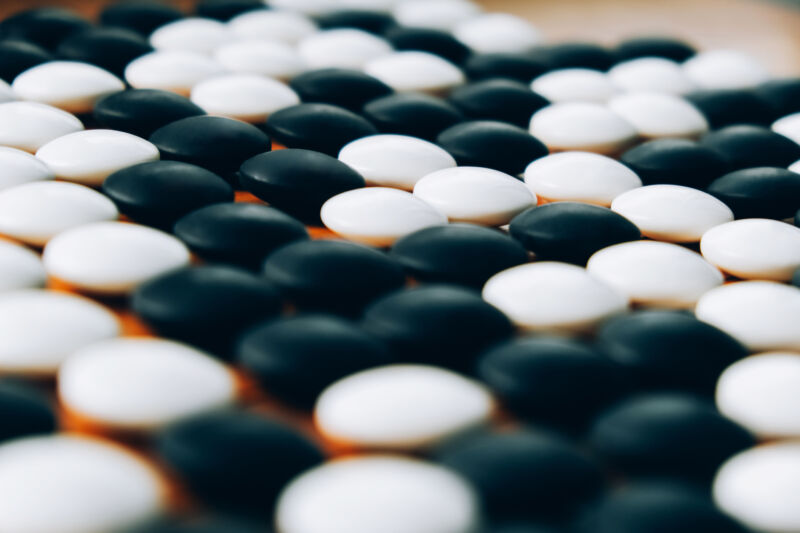 Man versus machine in a sea of ​​stones.