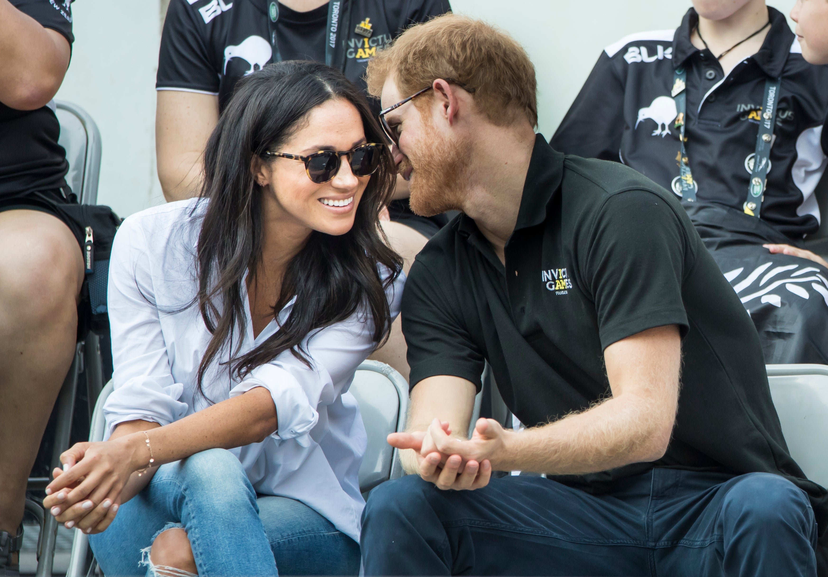 Harry and Meghan during a wheelchair tennis match in Toronto, Canada, in 2017 (Danny Lawson/PA)