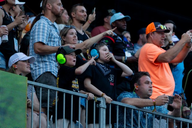 Fans cheer in the stands during the Grant Park 165 NASCAR Street Race on Sunday, July 7, 2024, at Grant Park in Chicago. (Vincent Alban/Chicago Tribune)