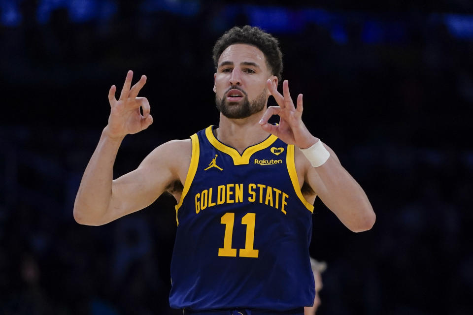 FILE - Golden State Warriors point guard Klay Thompson gestures after making a 3-pointer against the Los Angeles Lakers during the second half of an NBA basketball game, Tuesday, April 9, 2024, in Los Angeles. Klay Thompson is leaving the Golden State Warriors, the four-time league champion agreeing to join the Western Conference champion Dallas Mavericks and change franchises for the first time in his 13-year NBA career, two people familiar with the decision said Monday, July 1, 2024. (AP Photo/Ryan Sun)