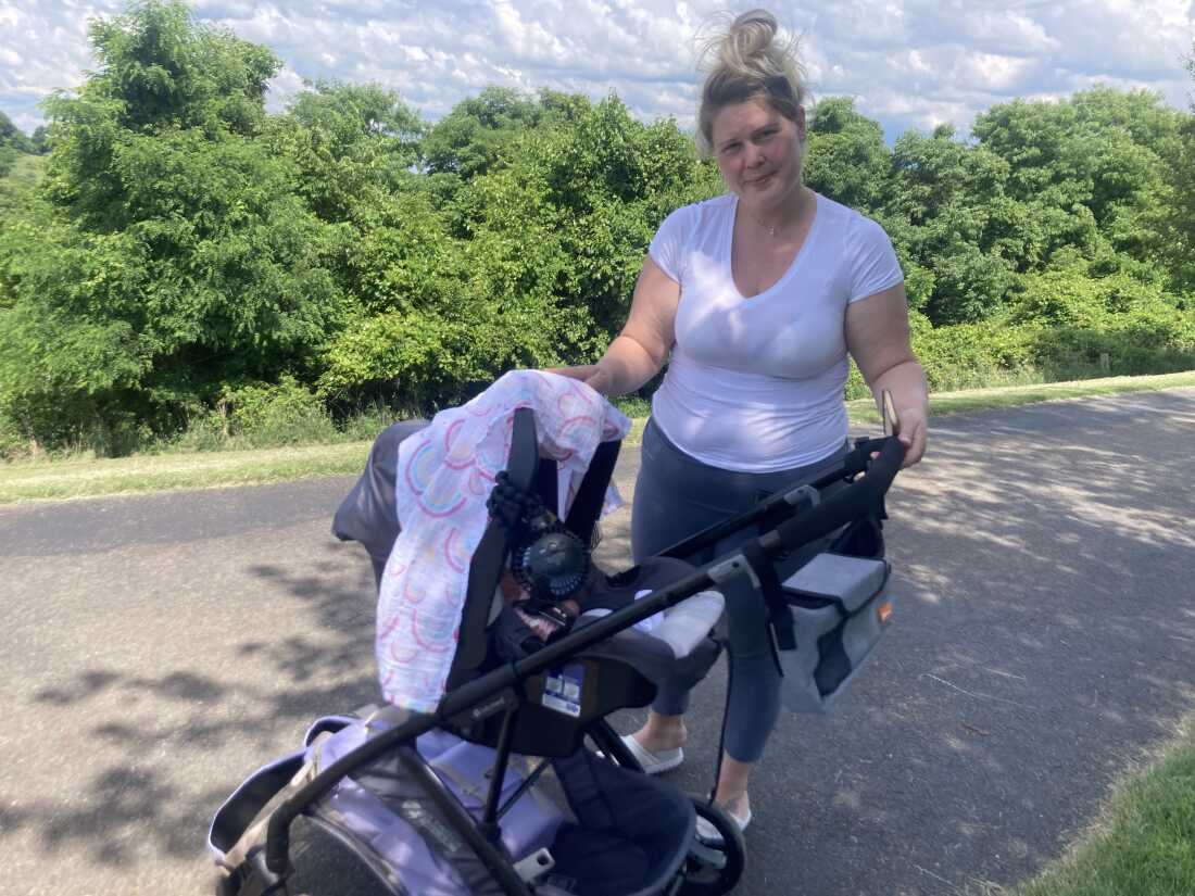 Molly Loveland and her daughter Maya in a park in Washington, Pennsylvania. Loveland works at a nearby nursing home. She worries about catching COVID-19 and passing it to her baby after she returns to work. Federal data shows that only 4 in 10 nursing home residents in the United States have received at least one dose of the most recent COVID vaccine, released last fall.