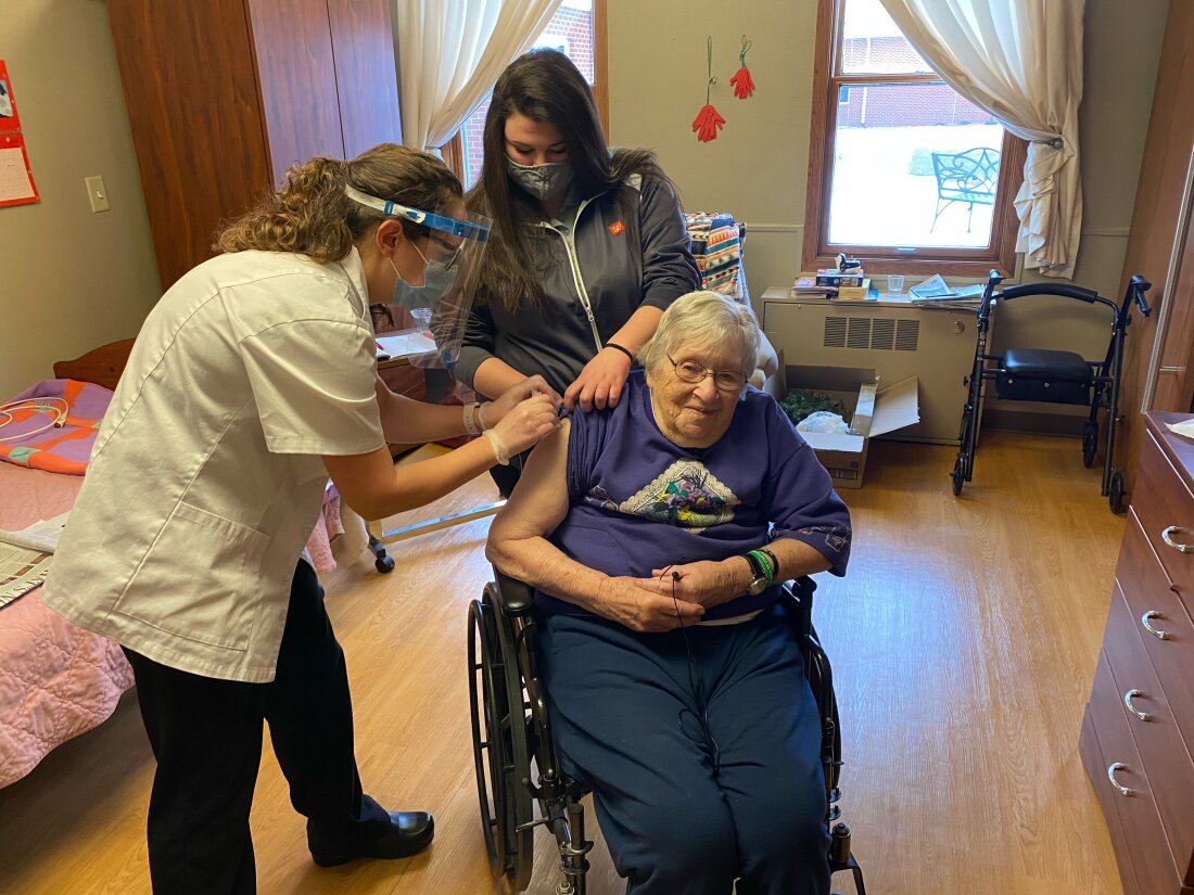 Mary Ann Herbst, a patient at the Good Samaritan Society nursing home in Le Mars, Iowa, receives her first COVID-19 vaccine shot on Dec. 29, 2020. A recent study found that only 4 in 10 nursing home residents in the United States have received at least one dose of the most recent COVID vaccine, released last fall.