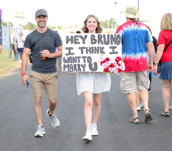 A girl wears the Bruno Mars sign at Bourbon and Beyond.JPG