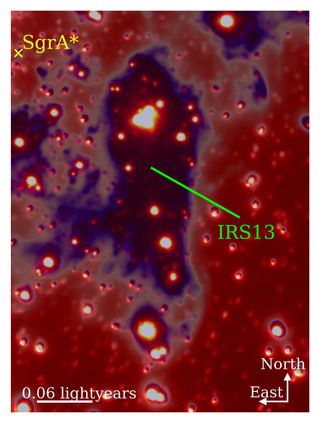 A large purple spot with glowing red and orange spheres inside