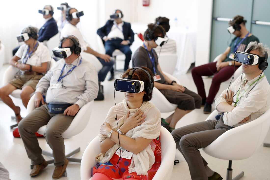 Visitors watch Jesus VR: The Story of Christ at the 73rd Venice Film Festival in 2016.