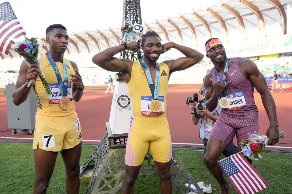 Noah Lyles celebrates after winning the men's 200 meters final with Kenny Bednarek and Erriyon Knighton during the U.S. Olympic track and field team trials, Saturday, June 29, 2024, in Eugene, Ore. (AP Photo/George Walker IV)