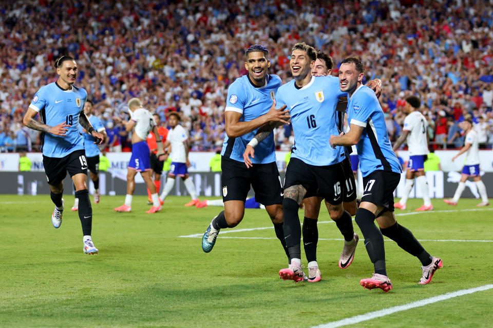 KANSAS CITY, MISSOURI - JULY 01: Mathias Olivera of Uruguay celebrates with teammates after scoring the team's first goal during the CONMEBOL Copa America 2024 Group C match between United States and Uruguay at GEHA Field at Arrowhead Stadium on July 01, 2024 in Kansas City, Missouri. (Photo by Michael Reaves/Getty Images)