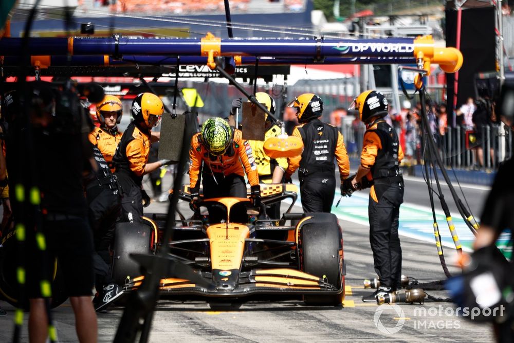 Lando Norris, McLaren MCL38, retires in the pit lane after contact with Max Verstappen, Red Bull Racing RB20, while battling for the lead